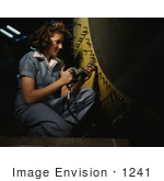 #1241 Stock Photo Of A Riveter Woman Working On A Consolidated Bomber