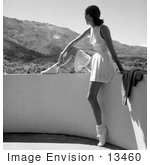 #13460 Picture Of A Young Caucasian Woman In A Tennis Uniform Sitting On A Balcony