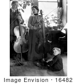 #16482 Picture Of A Family Of 3 With Parents Posed With Cellos And Son On The Floor