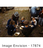 #17874 Photo Of A Family Sitting On Grass While Eating At A Fair In Pie Town New