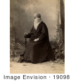 #19098 Photo Of A Turkish Woman Wearing A Niqab Veil On Her Face Sitting In A Chair Holding A Parasol