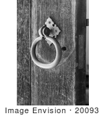 #20093 Stock Photo: Ringed Metal Door Knocker On A Wood Door