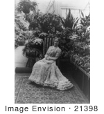 #21398 Stock Photography Of First Lady Ida Saxton Mckinley In A Gown Holding A Hand Fan In Her Lap Sitting In A Garden