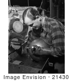 #21430 Historical Stock Photography Of A Male Worker Inspecting An Aviation Oxygen Cylinder At A Factory 1942