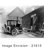 #21615 Historical Stock Photo Of A Detroit Electric Automobile Parked By A Building An Electric Cable Charging The Battery