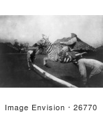 #26770 Stock Photography Of A Man Riding A Zebra And Jumping Over A Fence In East Africa