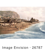 #26787 Stock Photography Of Blue Ocean Waves Rolling Towards Ships Net Shops And People On The Beach At The Fish Market On The East Cliff In Hastings East Sussex England Uk