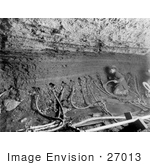 #27013 Stock Photography Of The Interior Of A Mine With A Miner Inserting Water Tubes In The Side Of The Shaft In Nome Alaska 1909