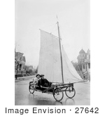 #27642 Stock Photo Of Two Men Pedaling Down The Street In Brooklyn New York On A Sail Wagon Also Known As A Sand Yacht Or Land Yacht