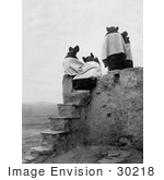 #30218 Stock Photo Of The Backs Of Four Hopi Native American Women Seated On A Roof At The Top Of Stairs On A Walpi Pueblo 1904