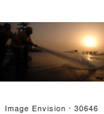 #30646 Stock Photo Of United States Navy Sailors Spraying Down The Flight Deck Of The Uss Harry S Truman (Cvn 75) Aircraft Carrier With A Fire Hose At Sunset