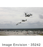 #35242 Stock Photo Of A V-22 Osprey Ch-53e Super Stallion Helicopter Ch-46 Sea Knight Helicopter Uh-1n Huey Aircraft And An Ah-1 Cobra Aircraft Performing A Formation Flight
