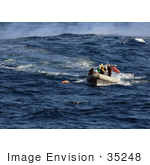 #35248 Stock Photo Of US Navy Sailors Using A Rigid Hull Inflatable Boat To Approach A Practice Dummy During A Man Overboard Drill While Under Way In The Pacific Ocean