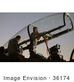 #36174 Stock Photo Of A Man Inspecting The Cockpit Of An F-15e Eagle Aircraft