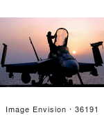 #36191 Stock Photo Of A Silhouetted F/A-18c Hornet And Person At Sunset