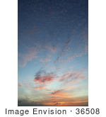 #36508 Stock Photo Of A Hawaiian Sunset Sky Of Pink And Orange Wispy And Spotted Clouds Over Blue
