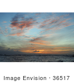 #36517 Stock Photo Of Scattered Orange And Pink Wispy Clouds At Sunset Over The Ocean Poipu Kauai Hawaii