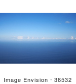 #36532 Stock Photo Of A Seascape Of Blue Rippling Waters Of The Pacific Ocean With Puffy White Clouds And Blue Skies
