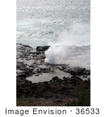 #36533 Stock Photo Of The Blowhole Of Spouting Horn Spraying Water Against A Backdrop Of The Pacific Ocean Poipu Kauai Hawaii