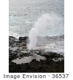 #36537 Stock Photo Of Spouting Horn On A Lava Shelf Spraying Water Against A Backdrop Of The Pacific Ocean Poipu Kauai Hawaii