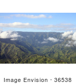#36538 Stock Photo Of An Aerial View Of The Valley Leading To The Heart Of Mount Waialeale With A Green Landscape And Puffy White Clouds