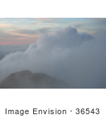 #36543 Stock Photo Of A Foggy Sunset Over Mountains In Kauai Hawaii