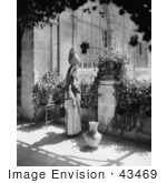#43469 Rf Stock Photo Of A Black And White Ramallah Woman Balancing A Jug On Her Head On A Patio