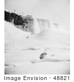 #48821 Royalty-Free Stock Photo Of People Walking Through The Snow Towards An Icy Mountain At Niagara Falls In Winter