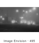 #495 Black And White Picture Of A Cars Stopped At A Traffic Light And Foggy Weater