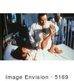 #5169 Picture Of A Doctor Examining A Child With Polio Disease