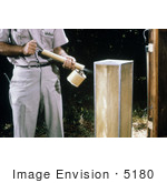 #5180 Stock Photography Of A Field Researcher Using A Hand-Held Sprayer To Knock Down Mosquitoes From The Screen Of A Horse Stable Mosquito Trap