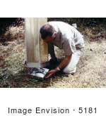 #5181 Stock Photography Of A Field Researcher Removing A Tray Filled With Mosquitoes From A Horse Stable Mosquito Trap