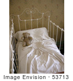 #53713 Royalty-Free Stock Photo Of A Teddy Bear In A Baby Crib