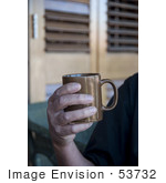 #53732 Royalty-Free Stock Photo Of A Man Holding A Hot Drink In A Mug