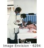 #6294 Picture of a Doctors Giving Health Care to a Female Lassa Fever Patient in the Segbwema, Sierra Leone Clinic by KAPD