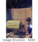 #6433 Picture Of A Boy Standing Beside A Rice Threshing Machine At A 1976 Sierra Leone Lassa Fever Field Study