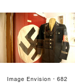 #682 Photograph Of A Nazi Flag And Uniform On Display