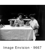 #9667 Picture Of Two Women Using A Toaster At A Table