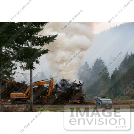 #1161 Picture of a Controlled Fire Beside a Tractor and Truck by Kenny Adams