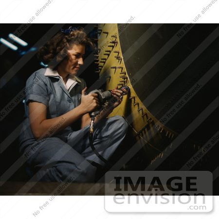 #1241 Stock Photo of a Riveter Woman Working on a Consolidated Bomber by JVPD