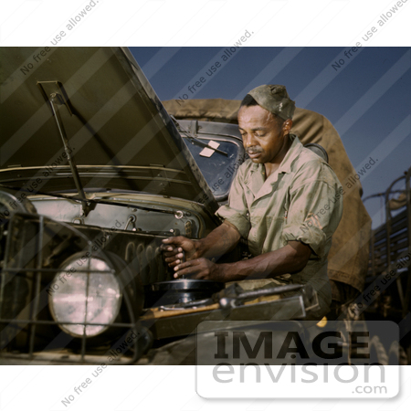 #12749 Picture of a African American Mechanic Working on a Motor by JVPD