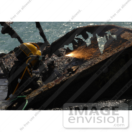 #13110 Picture of a Navy Diver Cutting Parts of a Shipwreck by JVPD