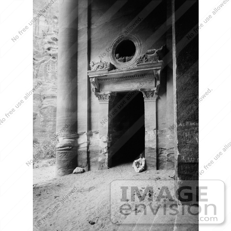 #13617 Picture of a Man Seated in a Doorway Under the Vestibule of the Treasury at Petra by JVPD