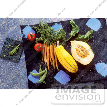 #17133 Picture of Veggies (Pease, Tomatoes, Carrots, Squash, Spinach and Green Beans) on Marble Cutting Boards on a Counter Top by JVPD