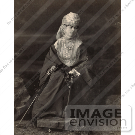 #19100 Photo of a Turkish Woman Wearing a Niqab Veil on Her Face, Sitting in a Chair and Holding Flowers and a Parasol by JVPD