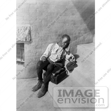 #20516 Historic Stock Photography of an Exhausted African American Boy With a Shoe Shine Box, Taking a Break From Shoeshining by JVPD