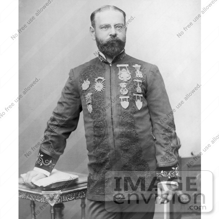 #21297 Stock Photography of John Philip Sousa Resting His Hand on a Stack of Papers on a Table by JVPD