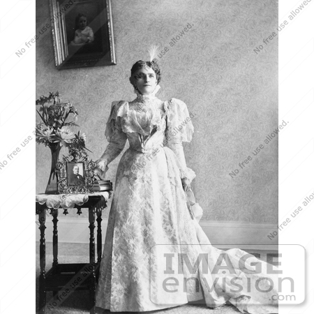 #21394 Stock Photography of Ida Saxton McKinley, First Lady and Wife of William McKinley, Standing in a Gown by a Portrait of Her Husband by JVPD