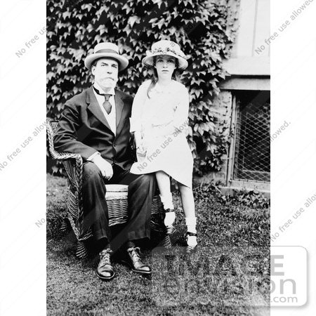 #21648 Stock Photography of Charles E Hughes Sitting in a Chair With His Granddaughter Elizabeth Beside Him by JVPD