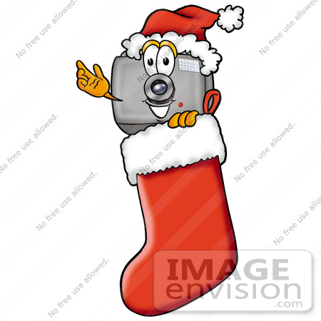 #23174 Clip Art Graphic of a Flash Camera Cartoon Character Wearing a Santa Hat Inside a Red Christmas Stocking by toons4biz